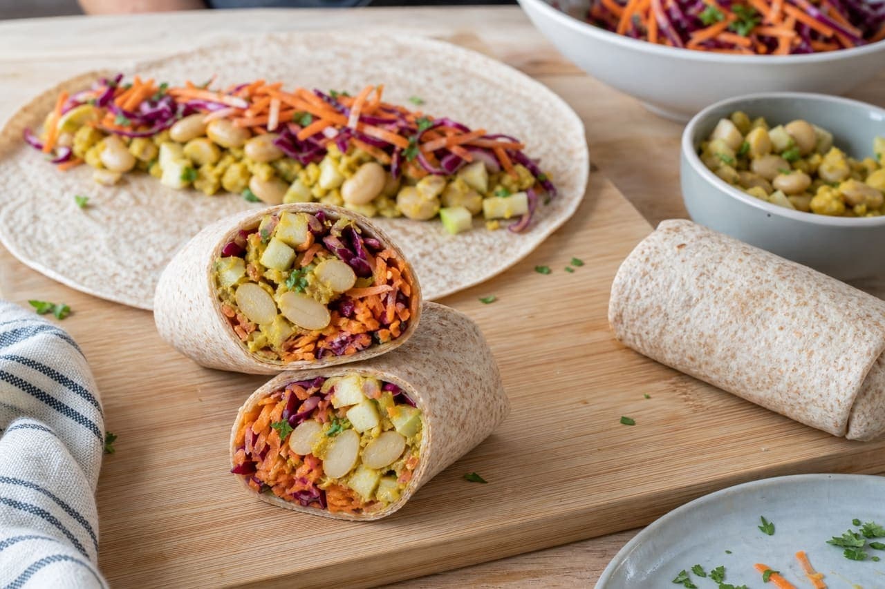 Curried Butter Bean Apple Wraps with Crunchy Carrot Slaw cooking step 6: Fill and roll.