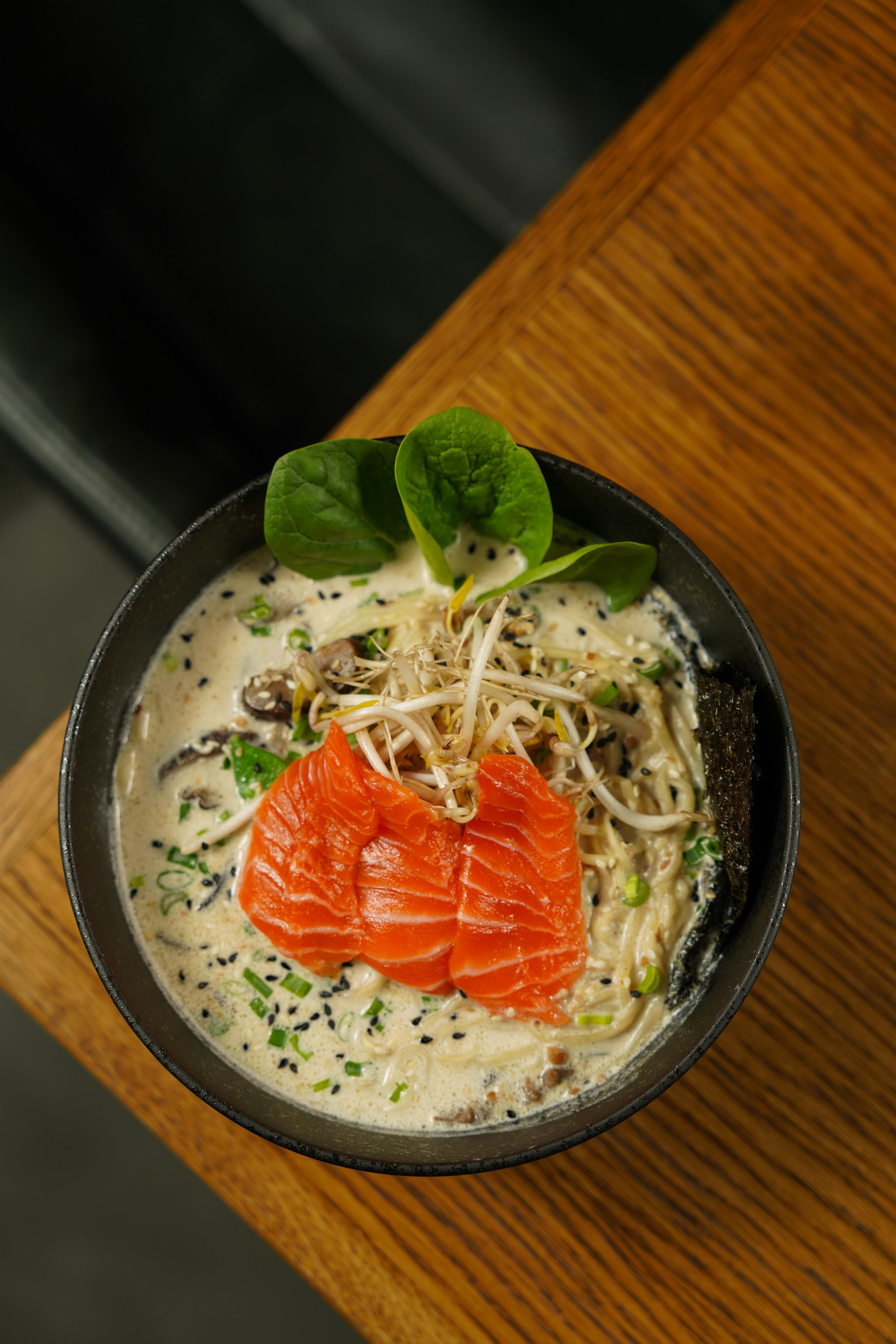 Plated salmon noodles in a bowl.