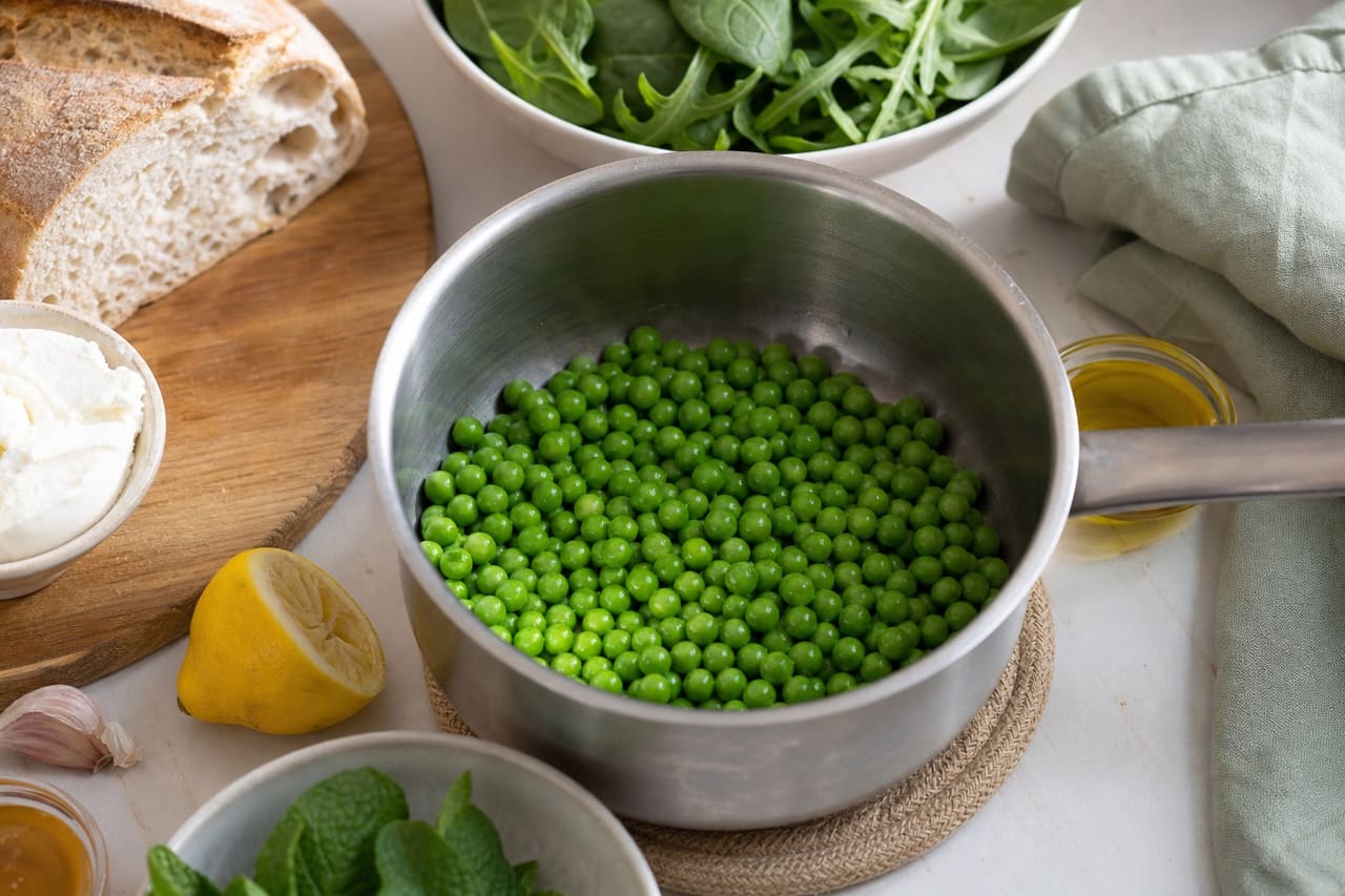 Goat's Cheese Pea Tartines with Lemon Herb Salad cooking step 2: Cook the peas.